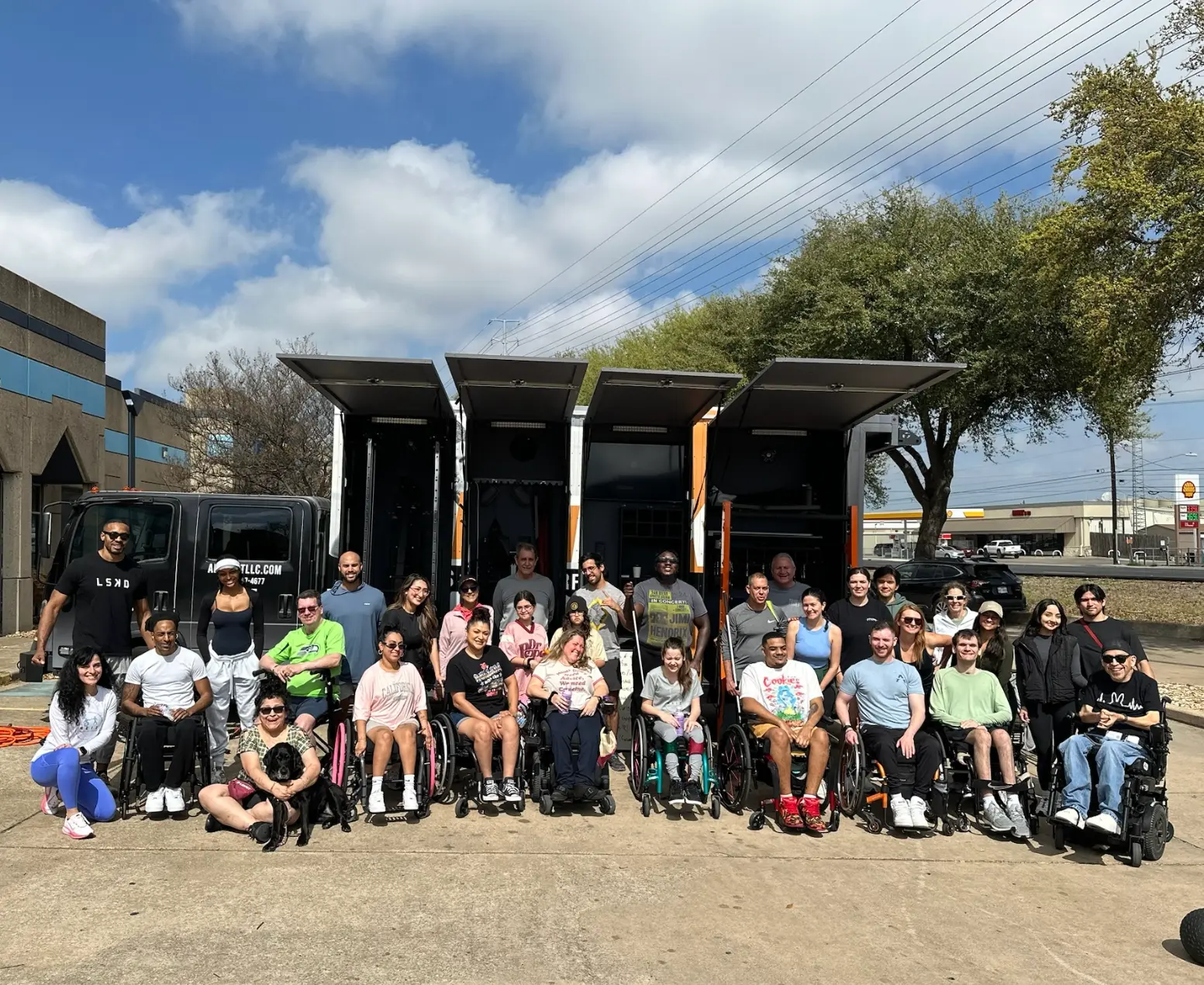 A large group of participants and coaches gathered together outdoors
